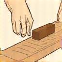 Icon einer Hand, die ein Holzstück restauriert